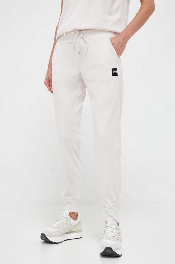 Спортивні штани Dkny колір бежевий однотонні (3443099)